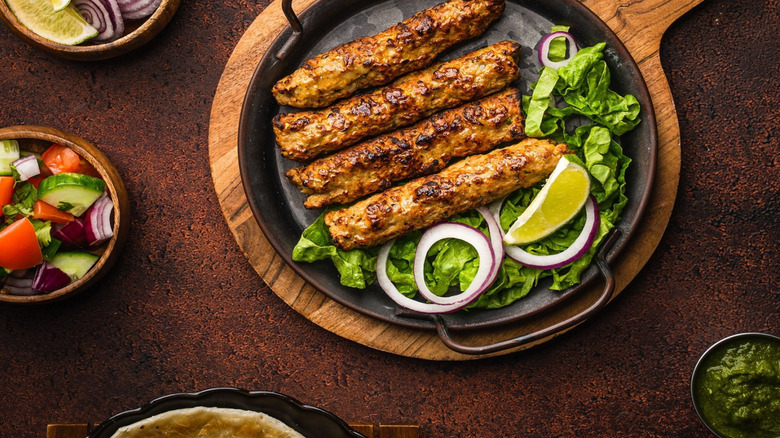 Skillet of Al-Safa chicken kebab with salad