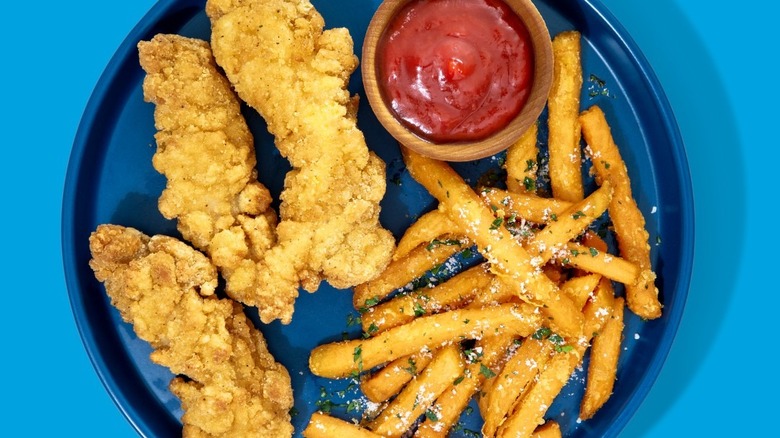 Plate of Perdue chicken tenders with fries and ketchup