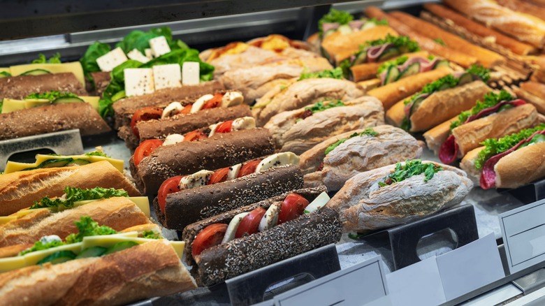 Meat and veggie sandwiches displayed in a coffee shop