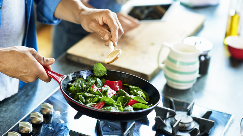 Cooking vegetables in pan