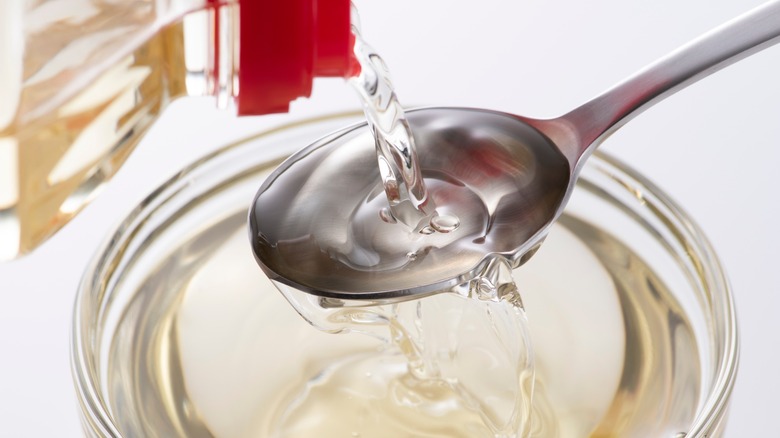 Pouring out mirin rice wine onto a spoon