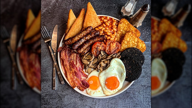 Full English breakfast on gray table