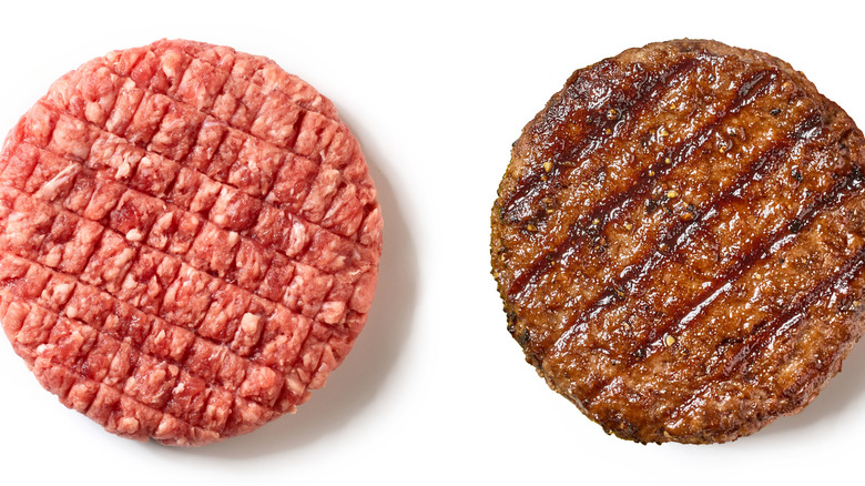 An uncooked hamburger patty next to a cooked patty