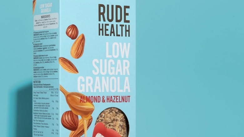 Box of Rude Health granola against a blue background