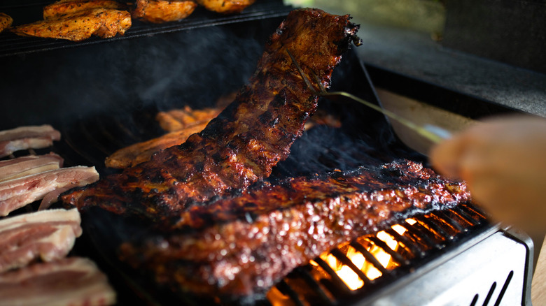 Hand grilling ribs and chicken