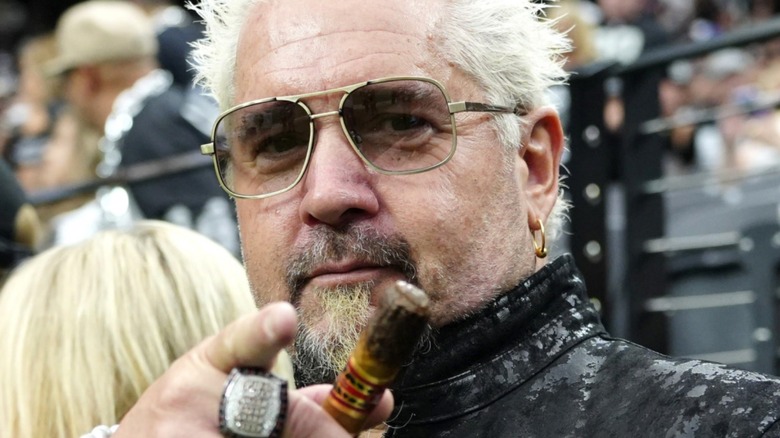 A photo of Guy Fieri wearing glasses