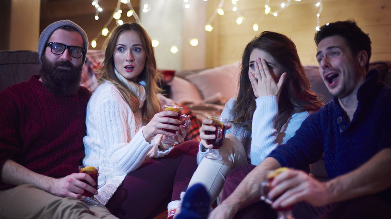 A group of friends reacts to Christmas movies