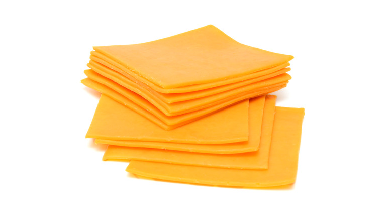 slices of cheddar on a white background