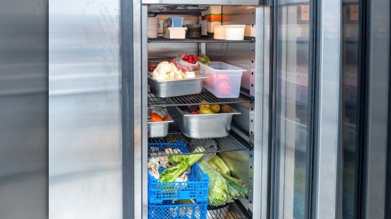 restaurant refrigerator holding various types of food