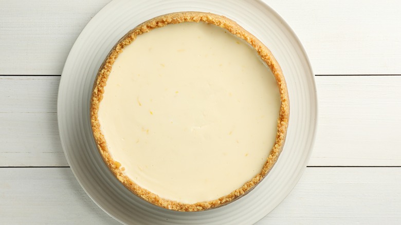 A whole no-bake cheesecake served on a plate