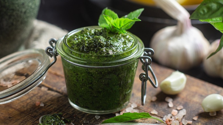 Open jar of pesto sauce