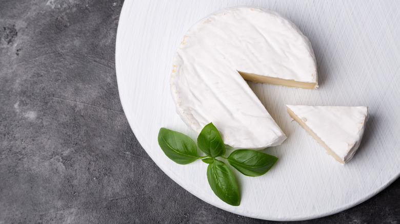 wheel of brie with wedge