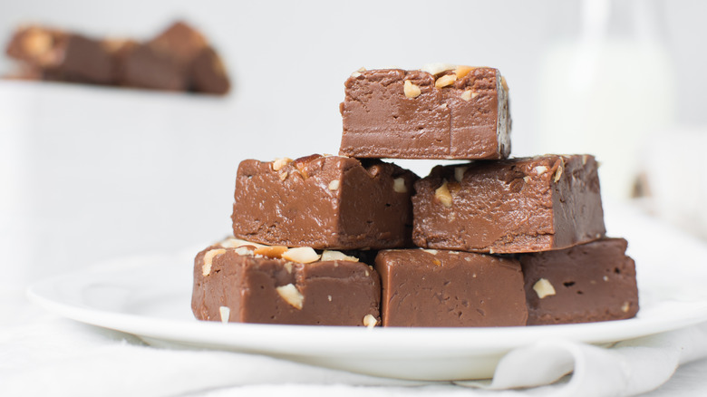 homemade chocolate fudge with nuts on a plate