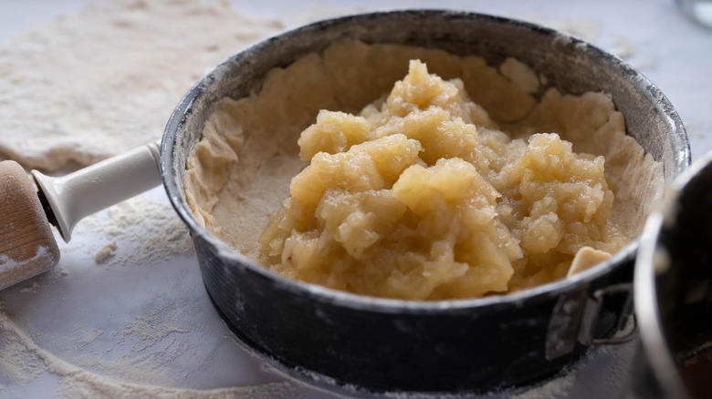 apple pie filling sitting inside a baking pan