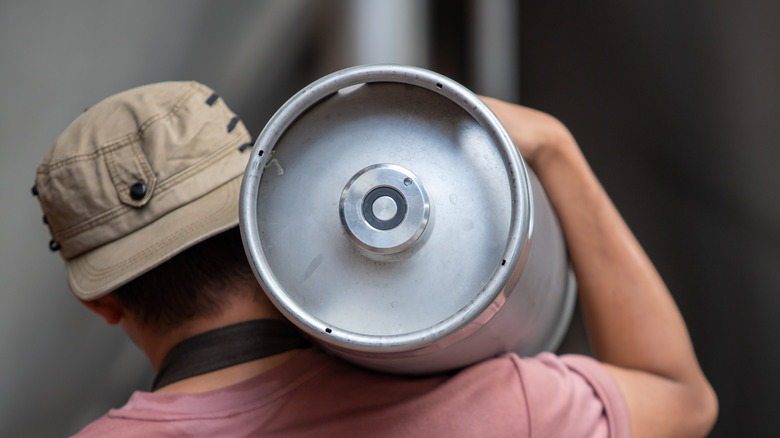 Man carrying beer keg