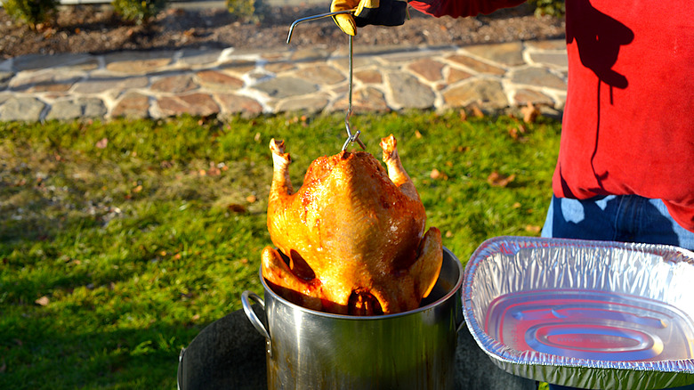 deep frying a whole turkey in the backyard