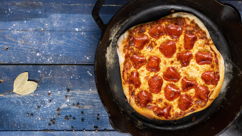 pepperoni pizza in a cast iron pan