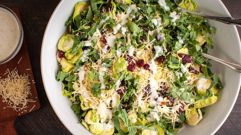 Hearty green salad with creamy dressing and parmesan