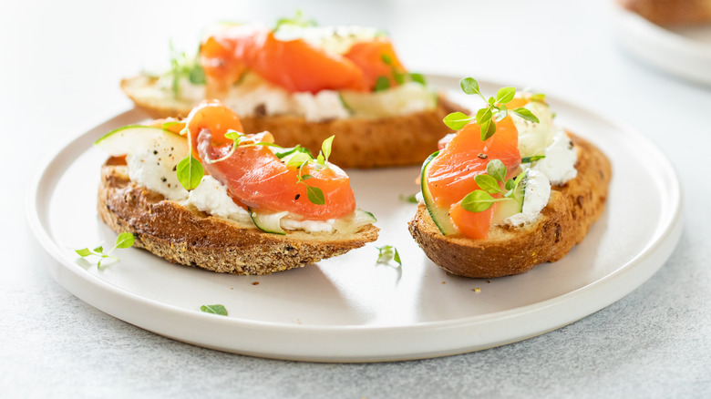 salmon crostini on white plate