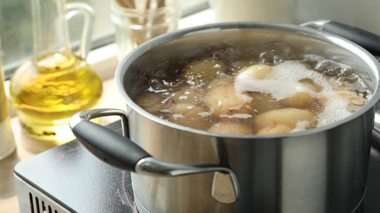 A pot of boiling potatoes.