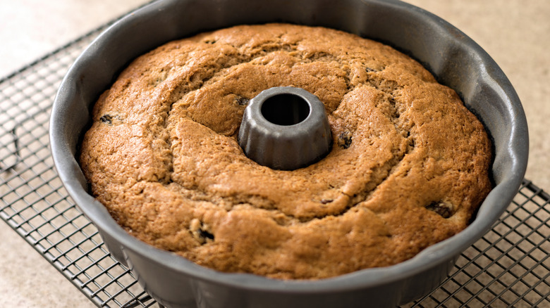 A bundt cake cooling in pan