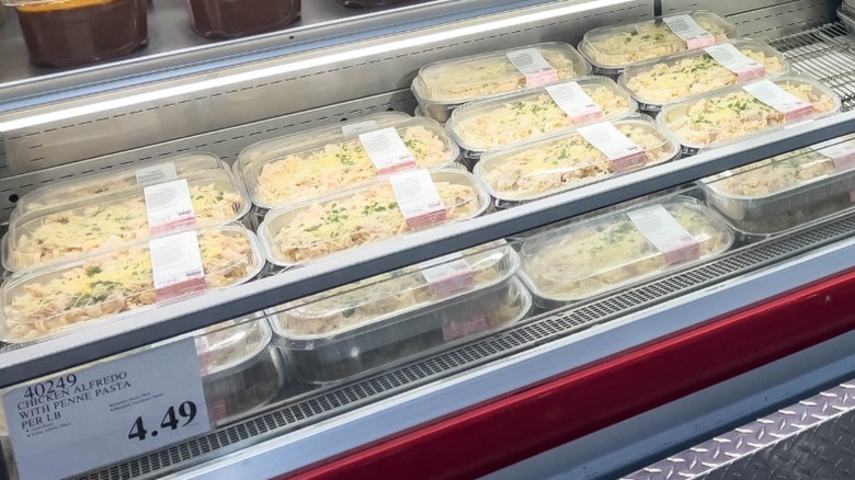 Pre-made chicken alfredo pasta in a cooler at Costco.