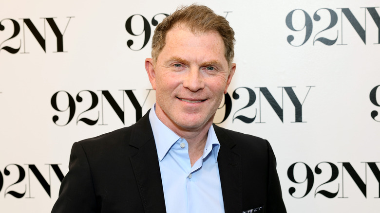 Bobby Flay wearing a suit at an event for 92NY.