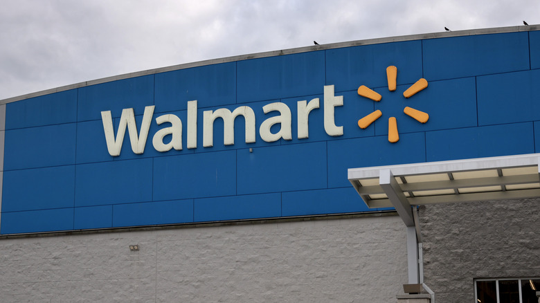 The exterior of a Walmart location during the daytime.