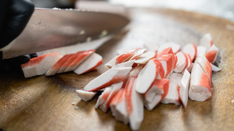 chef cutting imitation crab sticks