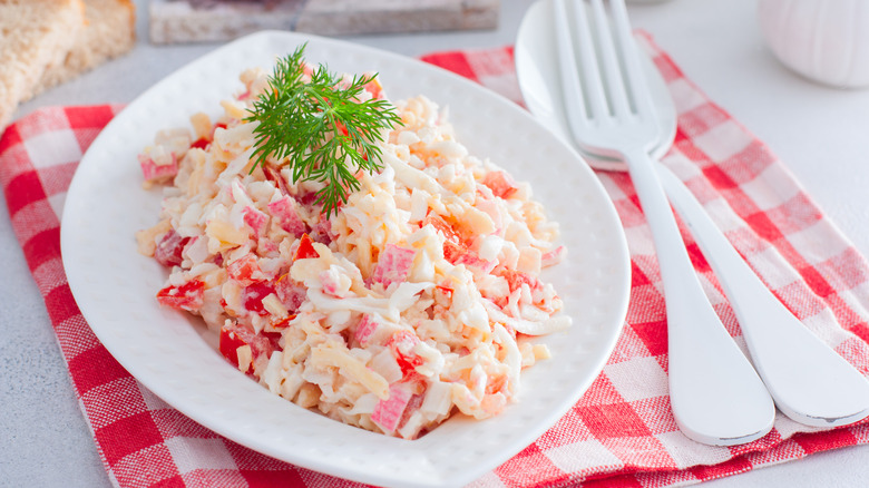 crab salad on a plate with checkered placemat