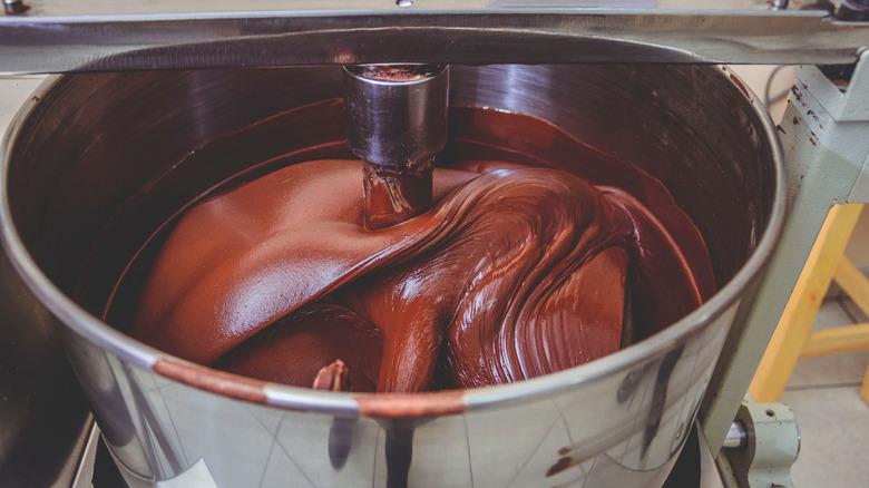 chocolate being churned in a large vat