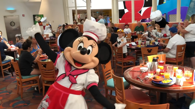 Buffet seating area with Minnie Mouse posing in the front