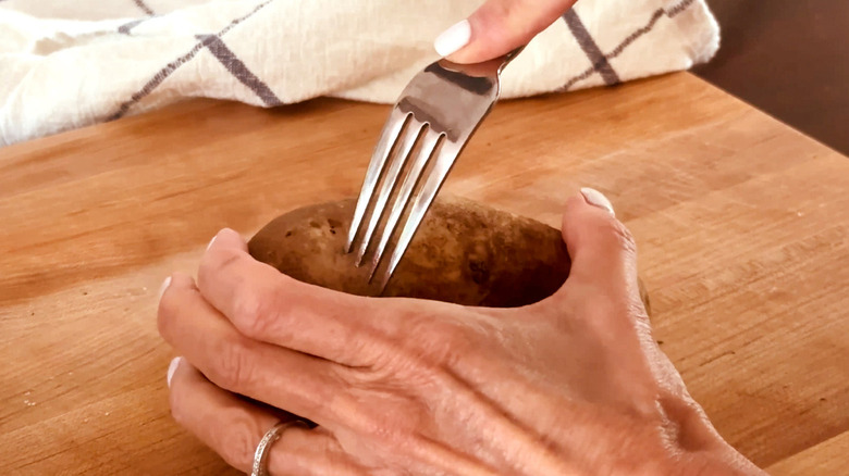 fork poking potato