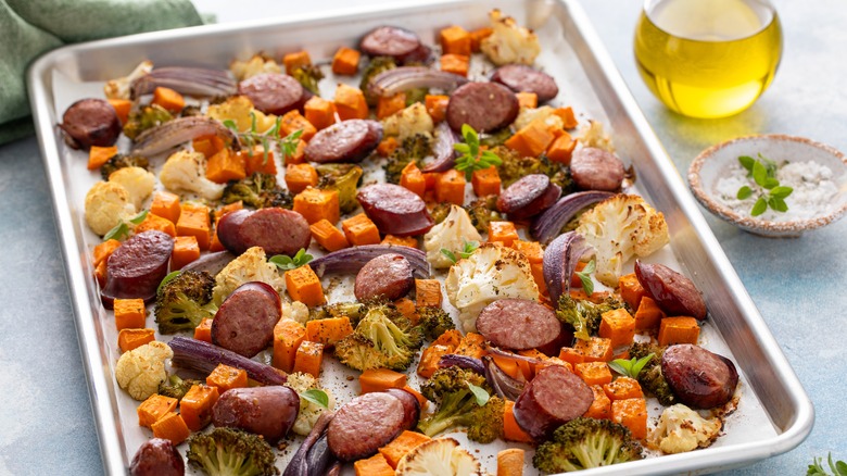 Sheet pan with sausage slices and vegetables