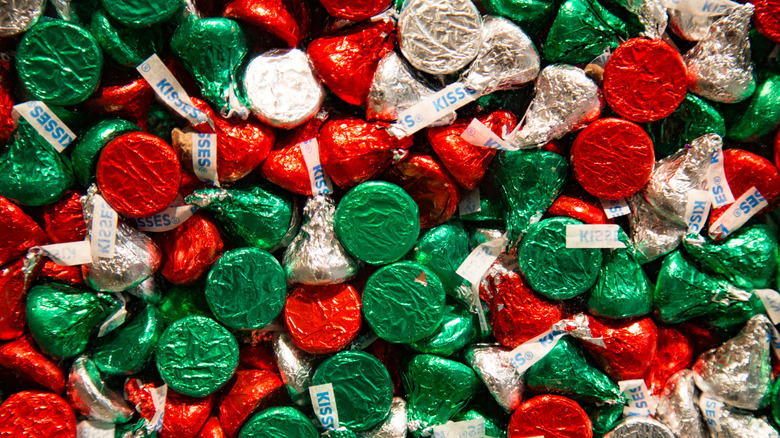 a big pile of Hershey's kisses in Christmas colors