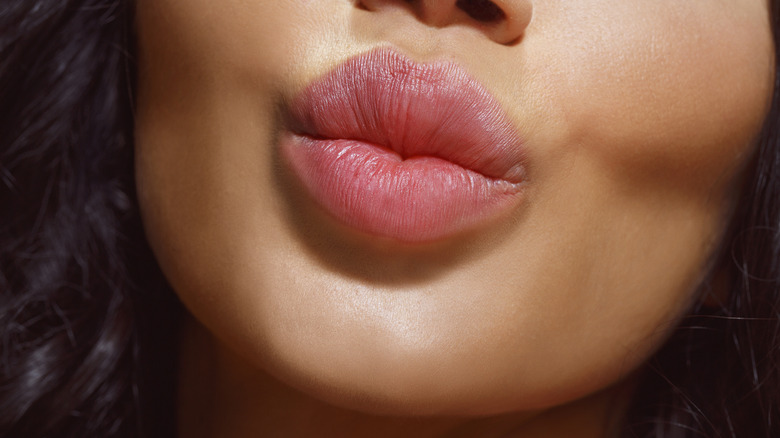 Person's puckered lips