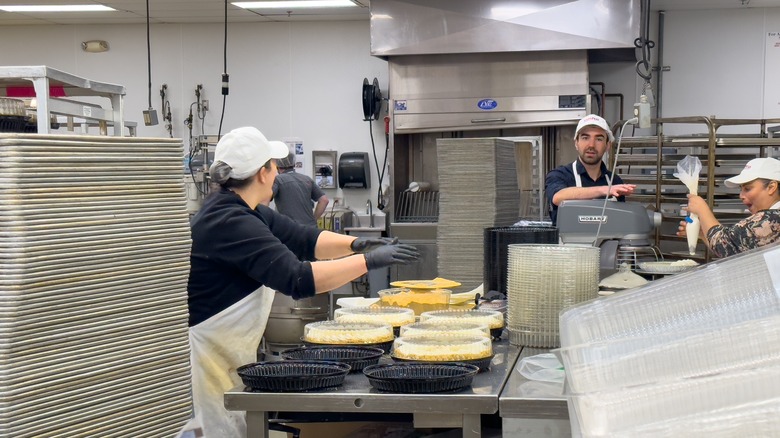 Costco employees working in the bakery