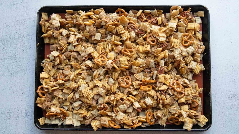 unbaked Chex mix on a sheet pan