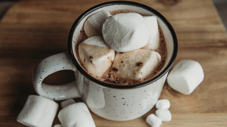 White mug with hot cocoa and lots of marshmallows