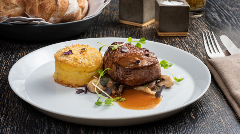 A steak served on a plate.