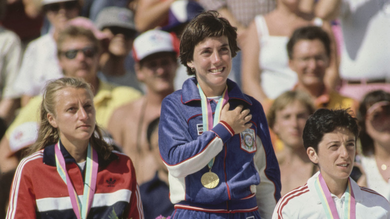 American athlete standing on the podium at the 1984 Olympics.