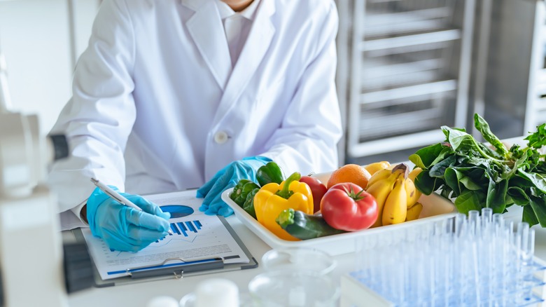 Researcher inspecting fruits and vegetables