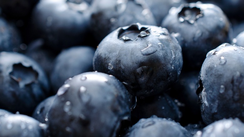 Fresh blueberries up close with water marks on them