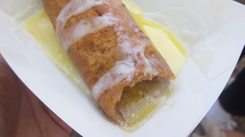 a deep-fried stick of butter with a bite taken from it