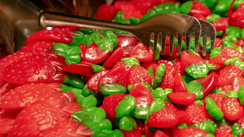 Three cups of red, green, and blue food coloring