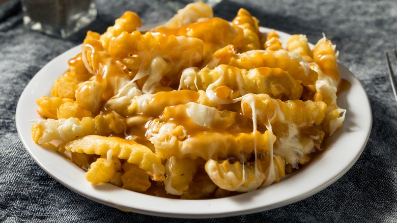 A plate of disco fries with cheese and gravy