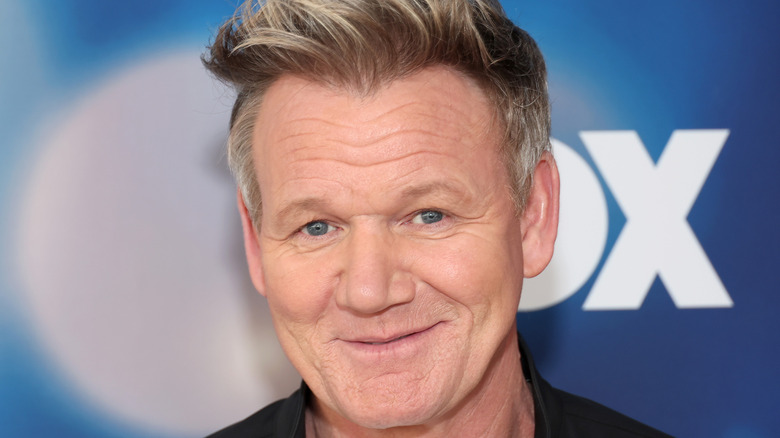 Gordon Ramsay attends the 2023 FOX Winter Junket at Fox Studio Lot on December 13, 2023 in Los Angeles, California. Headshot with blue FOX background