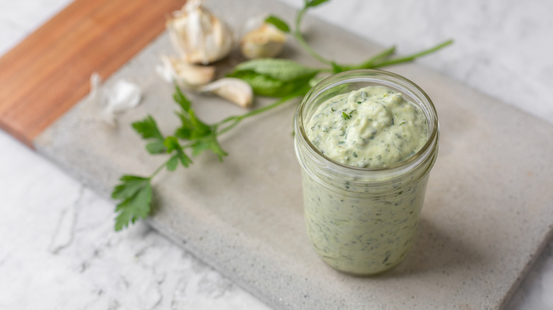 Homemade green goddess dressing with basil and herbs