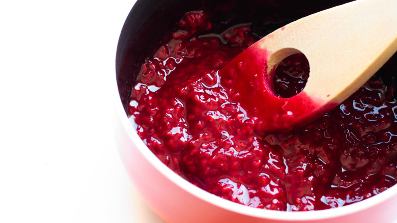 Raspberry sauce in a pink pan