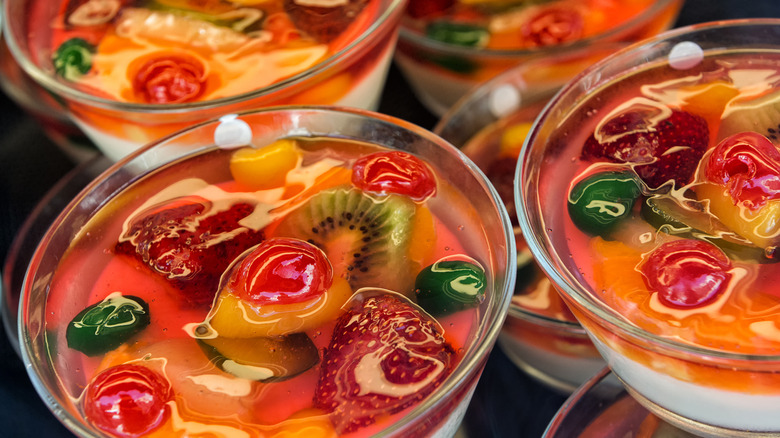 Layered gelatin fruit salads in glass dessert dishes